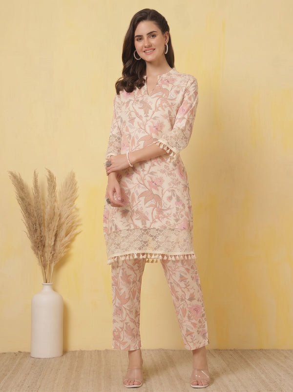 Soft pink floral co-ord set with 3/4 sleeves: straight kurta and matching ankle pants