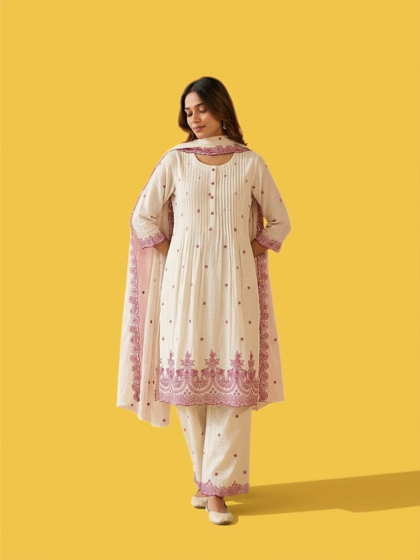 Off-white anarkali kurta with scalloped pink border on sleeves and hem, and dupatta